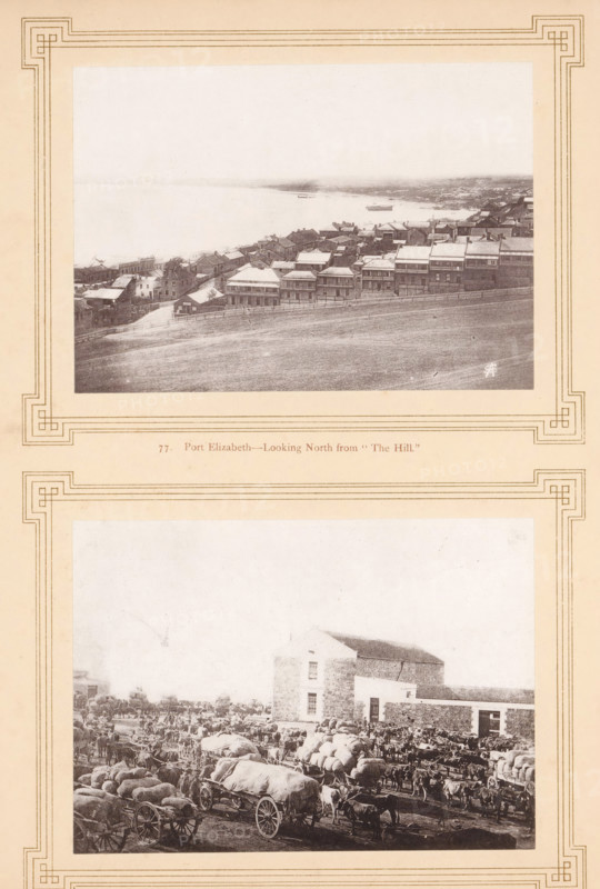 Mossel Bay, Port Elizabeth-looking North from 'the hill', page, photomechanical print, inscription: 'SA', number: '77. 78.', photographer: Sam Alexander (possibly), South Africa, cliché maker: anonymous, c. 1870 - in or before 1880, paper, collotype, photoprint, height 290 mm x width 219 mm, city-view in general, 'veduta', gulf, bay, (farm) wagon, freight wagon, cart, Western Cape, Eastern Cape, Port Elizabeth, Algoa Bay, A sepia-toned page with decorative borders contains two rectangular photographs vertically aligned; the top photograph shows a coastal town seen from an elevated grassy slope, with rows of closely packed houses and buildings sloping toward a calm body of water where small boats are visible, and a fenced path runs along the hill in the foreground; the lower photograph depicts a busy dock or market scene with covered wagons and carts pulled by animals, stacks of bales and sacks, crowds of people and numerous animals clustered around a large stone building, all rendered ...