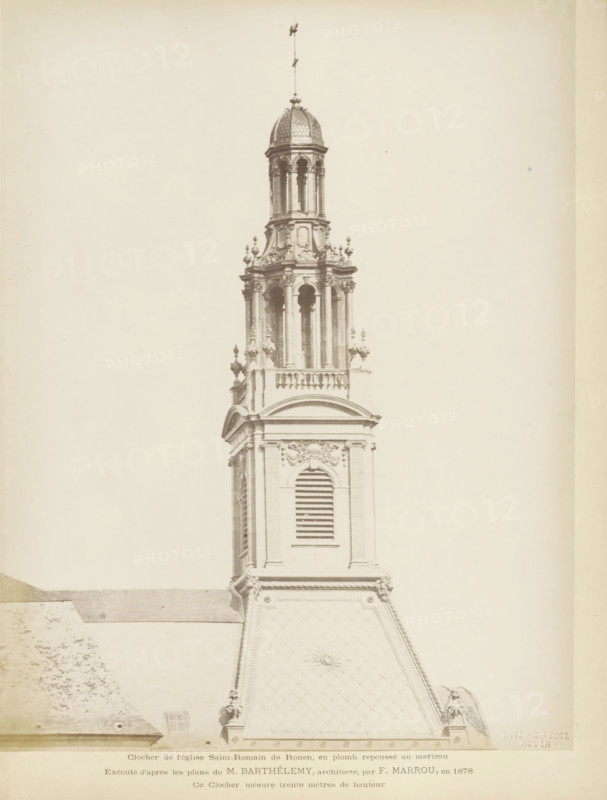 Spere of the Église Saint-Romain in Rouen, Clocher de l'eglise Saint-Romain de Rouen, en plomb repoussé au marteau, photograph, page, name: 'Witz & cie Phot. Rouen', inscription: 'Exécutés d'après les plans de M. Barthélemy, architecte, par F. Marrou, en 1878 Ce Clocher mesure trente mètes de hauthor', photographer: Witz et Cie., Rouen, 1878, paper, albumen print, albumendruk, height 277 mm x width 211 mm, parts of church exterior and annexes: steeple, A tall ornate church tower rises from a steep sloped roof, showing classical architectural details and decorative stonework; the tower features arched louvered openings, pilasters, sculpted balustrades, ornamental finials, and a cylindrical lantern capped by a domed roof with a slender spire; the roof below the tower is patterned with diamond-shaped tiles and a central decorative motif; the image is monochromatic and framed with wide blank margins.