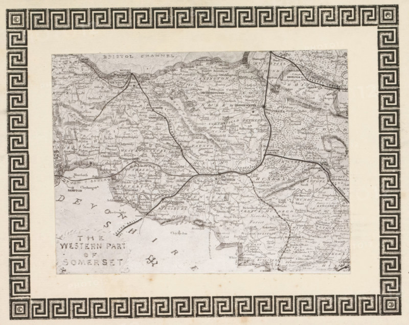 Photo reproduction of a print, depicting a map of West Somerset, reproduction, page, photomechanical print, cliché maker: anonymous, after print by anonymous, c. 1868 - in or before 1873, photographer, after print by, paper, photoaquatint, height 96 mm x width 127 mm, Print on frontispiece., maps of separate countries or regions, Somerset, West Somerset, A rectangular ornate border with a repeating geometric inner pattern and a decorative outer floral scroll surrounds an inset rectangular map that is tilted slightly; the border is dark ink on a pale background and shows corner flourishes and a patterned band running along each side, while the inset map is a grayscale, detailed topographic illustration with winding lines representing roads or rivers, varied shading for terrain, and small clustered marks indicating settlements.