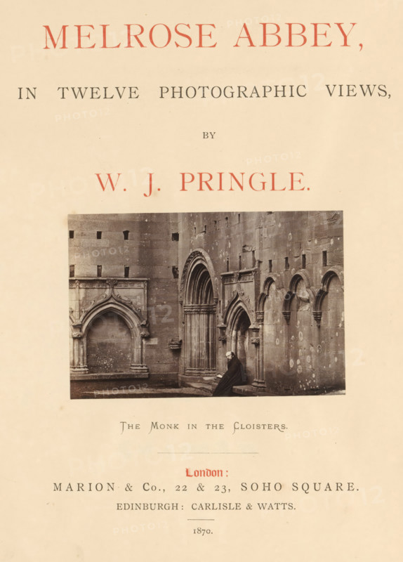 Melrose Abbey, in twelve photographic views, book, publisher: Marion & Co, London, publisher: Carlisle & Watts, Edinburgh, 1870, biological material, paper, linen (material), textile materials, leather, albumen print, color on cut, height 286 mm x width 240 mm x thickness 15 mm, A pale paper page with a centered rectangular black-and-white photograph of a stone cloister wall showing arched doorways and carved architectural details, a seated robed figure at the base of the arches, and surrounding masonry with visible patches and weathering, all framed by wide blank margins.
