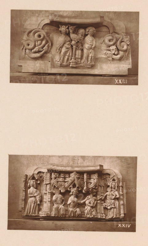 Two carvings in Worcester Cathedral, page, photomechanical print, Above Moses with the bronze serpent between two fantasy creatures, below the Adoration of the Magi., number: 'XXIII, XXIV', c. 1863 - in or before 1873, paper, Woodburytype, Woodburytypie, height 306 mm x width 244 mm, adoration of the kings: the Wise Men present their gifts to the Christ-child (gold, frankincense and myrrh), interior of church, anyone who is bitten by a snake is cured by looking at the brazen serpent, the serpent (or dragon) is usually depicted on a tau-shaped cross or on a pillar, carving, applied arts, A vertical image showing two separate sepia photographs of carved wooden panels mounted on a sheet. The upper photograph depicts a horizontal carved panel with a curved top edge, featuring three standing human figures in robes grouped around a central column topped by a bird, flanked on each side by coiled serpentine creatures with textured scales and horned faces. The lower photograph shows a wider hor...