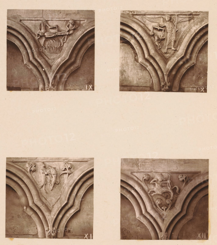 Four woodcarvings in an arcade of Worcester Cathedral, page, photomechanical print, Top left a sinner being roasted over a fire, top right an angel weighing souls, bottom left a man fighting a lion, bottom right a centaur with bow and arrow., number: 'IX, XII', c. 1863 - in or before 1873, paper, Woodburytype, Woodburytypie, height 305 mm x width 244 mm, interior of church, Sagittarius (zodiacal sign of November), psychostasis, the Archangel Michael weighing the souls in the scales (and stabbing the devil), carving, applied arts, The image shows four close-up photographs of carved stone architectural details arranged in a grid on a pale background. Each photograph captures a triangular section where curved ribbed arches converge toward an ornamental pendant. The top left photo features a carved scene with a horizontal beam and small figures above stylized flame-like foliage, with layered curved moldings framing the scene. The top right photo shows a winged figure holding a scale-like o...
