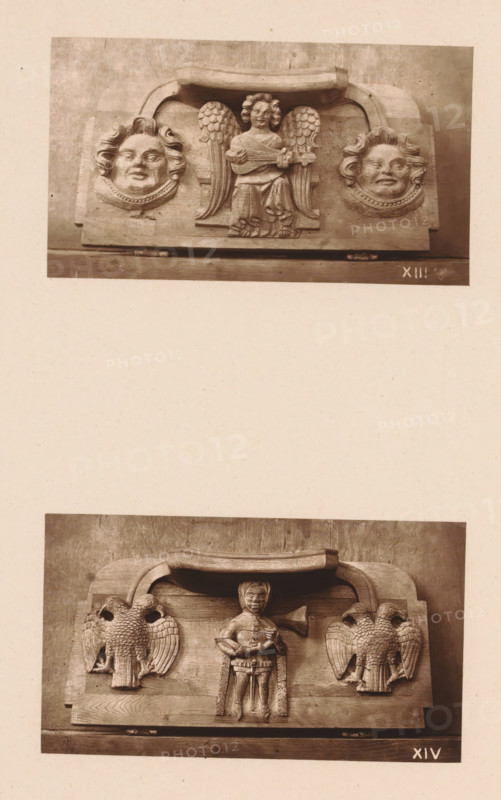 Two woodcarvings in Worcester Cathedral, page, photomechanical print, Above: a musical angel between two faces, below: a knight between two two-headed birds., number: 'XIII, XIV', c. 1863 - in or before 1873, paper, Woodburytype, Woodburytypie, height 306 mm x width 244 mm, interior of church, knight, angels singing, making music, carving, applied arts, A sepia photograph shows two separate carved wooden panels mounted on a neutral background, the upper panel featuring a central winged figure holding a small stringed instrument flanked by two rounded faces with stylized hair and decorative collars, and the lower panel depicting a central standing human figure with a trumpet-like instrument beside two symmetrical birds with detailed feathering, all carvings set within arched top frames and resting on flat bases.
