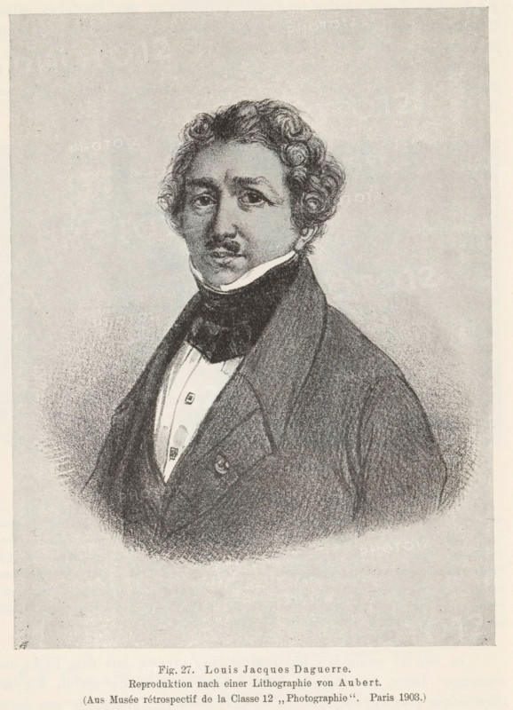 Photo reproduction of a print depicting a portrait of Louis Jacques Daguerre, Louis Jacques Daguerre, reproduction, page, photomechanical print, number: 'Fig. 27.', after print by Aubert & Cie., c. 1900 - in or before 1905, Aubert & Cie., after print by, paper, autotypie, height 140 mm x width 106 mm, Person, Louis Jacques Mandé Daguerre, portrait, self-portrait of photographer, A monochrome lithographic portrait of a man shown from the chest up, with curly hair and a narrow mustache, wearing a high-collared shirt and a dark cravat under a dark double-breasted coat, the figure set against a plain, lightly textured background and centered on a page that has a wide blank margin below.