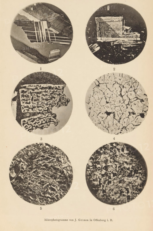 Six microscopic enlargements of minerals, page, photomechanical print, Image 1, 2 and 3 is plagioclase, 4, 5 and 6 is serpentine., number: '1, 6', number: 'Tafel XXVI', photographer: Emil Cohen, Greifswald, cliché maker: J. Grimm, Offenburg, c. 1880 - in or before 1885, Baden-Württemberg, Mecklenburg-Vorpommern, paper, collotype, photoprint, height 233 mm x width 149 mm, minerals and metals, A vertical sheet showing six circular grayscale close-up images arranged in two columns and three rows, each circle containing distinct textured patterns and irregular shapes; the top left circle shows layered angular bands and smooth dark areas with a diagonal light stripe, the top right circle has blocky rectangular forms and scattered speckles on a dark background, the middle left circle displays a porous, honeycomb-like structure with jagged edges, the middle right circle features a cracked, mosaic pattern of light and dark irregular polygons, the bottom left circle contains dense, fibrous stri...