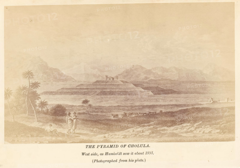 The pyramid of Cholula, photograph, reproduction, page, inscription: 'West side, as Humboldt saw it about 1803.', Mexico, after print by Humboldt, c. 1870 - in or before 1880, Humboldt, photographer, after print by, North America, paper, albumen print, height 92 mm x width 151 mm, Photo after page 156., church (exterior), quadrangular pyramid, Great Pyramid of Cholula, Iglesia de Nuestra Señora de los Remedios, A wide sepia-toned landscape showing a stepped pyramidal mound at the center surrounded by flat agricultural terraces and distant mountain ranges under a pale sky, with scattered palm trees and shrubs in the foreground, a small group of people standing near the lower left edge with one seated figure nearby, a line of animals being led across the middle ground, and a few small buildings visible near the right shoreline.