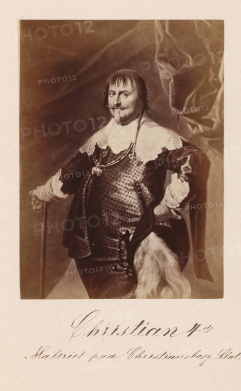 Photographic reproduction of a painting, depicting a portrait of King Christian IV of Denmark, Christian IV, photograph, reproduction, page, inscription: 'Maleriet paa Christiansborg Slot.', photographer: Julius Wulff, after painting by Karel van Mander (I), c. 1858 - in or before 1862, paper, albumen print, height 167 mm x width 123 mm, Person, ruler, sovereign, insignia and symbols of sovereignty (crown, diadem, scepter, orb, seal, standard, cloak, pectoral), A sepia-toned portrait of a man standing in ornate clothing, wearing a lace collar and a textured chainmail-like garment beneath a dark coat, with one hand resting on a cane and the other on his hip; he has a mustache and goatee, straight hair with bangs, and a long thin braid; a draped curtain is visible behind him on one side and a fur-trimmed item hangs near his waist.