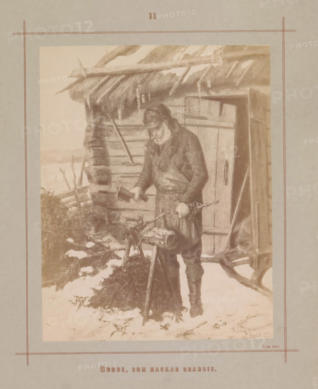 Photo reproduction of a painting by Karl Emanuel Jansson, depicting an old man chopping wood from spruce, Gubbe, som hackar granris, photograph, reproduction, page, inscription: 'Åland 1871', number: 'II', photographer: Daniel Nyblin, after painting by Karl Emanuel Jansson, c. 1871 - in or before 1880, paper, albumen print, albumendruk, height 176 mm x width 138 mm, picture, painting, woodcutting, woodcutter, forestry, old man, An aged man wearing a coat and cap stands outside a rustic wooden cabin with a thatched roof, holding an axe in one hand and a log in the other; snow covers the ground around him and clumps of brush and chopped wood are visible nearby, while the cabin shows a door with a handle and rough timber walls, and the scene is framed by a pale border with thin decorative lines.
