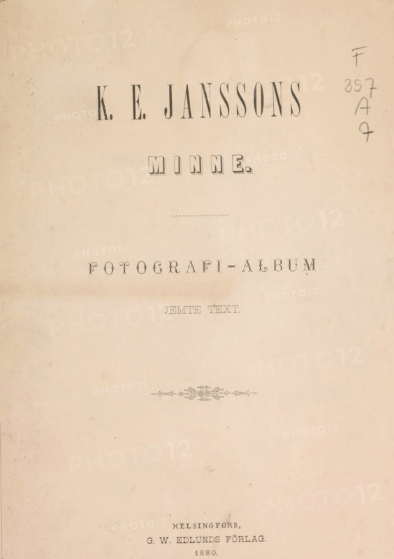 KE Janssons minne : fotografi-album, book, publisher: GW Edlunds Förlag, Helsinki, 1880, textile materials, pasteboard, paper, linen (material), albumen print, printing, height 334 mm x width 260 mm x thickness 15 mm, A faded, beige page with decorative printed lines and large bold headings centered near the top, a narrow wavy divider below them, a small ornate horizontal flourish in the middle area, and scattered pencil markings along the right edge, all on a mottled, aged paper background.