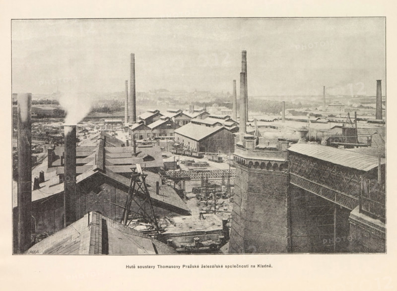 Hute soustavy Thomasovy Prazské zelezárské spolecnosti na Kladne, Exterior of an ironworks in Kladno, page, photomechanical print, Kladno, cliché maker: Carl Bellmann, Prague, c. 1890 - in or before 1895, photographer, Bohemia, paper, autotypie, height 170 mm x width 262 mm, exterior of industrial structures, factories, A wide industrial scene with numerous brick buildings and long sloping roofs, tall cylindrical smokestacks rising from various points, and one stack emitting a plume of white smoke; metal frameworks, pipes, and scaffolding are visible among rooftop machinery and equipment; a large ornate brick structure with patterned masonry and an attached metal lattice walkway appears in the foreground on the right; rows of smaller gabled factory buildings extend toward the middle ground, interspersed with additional chimneys and open yards containing scattered materials and railway cars; the distant background shows a hazy flat landscape and low-lying structures under a pale sky.