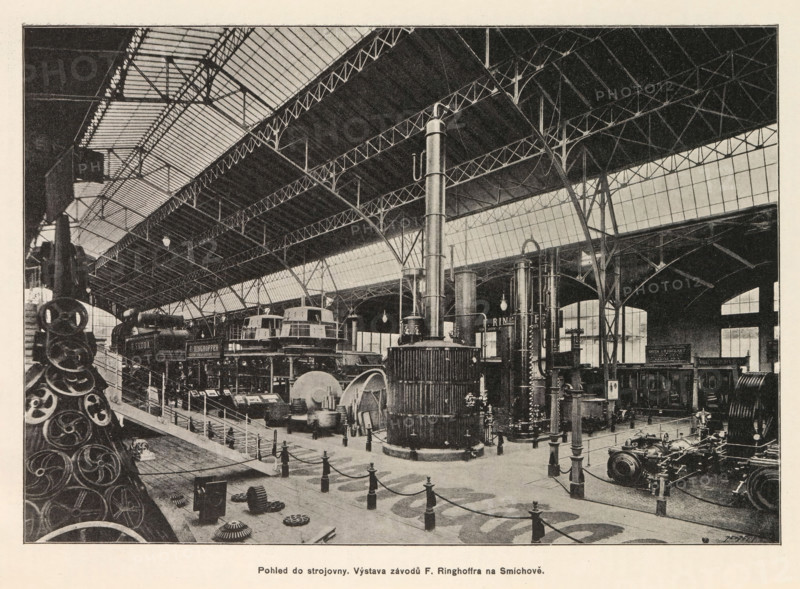 Interior of an engine room with an exhibition of Skoda, Pohled do strojovny. Výstava závodu E. Skody v Plzni, page, photomechanical print, Prague, cliché maker: Carl Bellmann, c. 1890 - in or before 1895, photographer, paper, autotypie, height 176 mm x width 258 mm, interior, representation of a building, machines, parts of machines, tools and appliances, The image shows the interior of a large industrial exhibition hall with a high iron and glass roof supported by slender arched metal columns and trussed beams; the floor area is filled with heavy machinery including tall cylindrical boilers, large gears, flywheels, and other engine components arranged behind short posts connected by chains, with display platforms and stairways; lantern-style lights hang from the roof and large windows along the side wall admit light; in the foreground there is a stack of circular metal parts and various scattered smaller components on the floor, while further back are mounted machines and a tall verti...