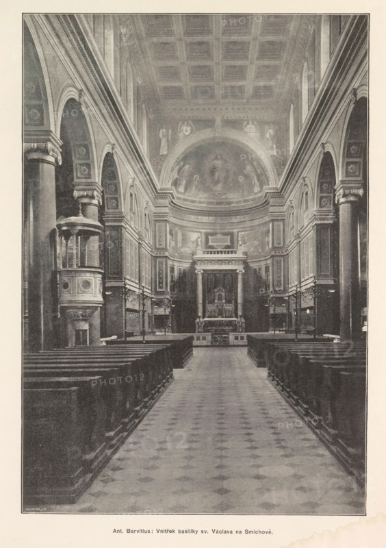 Ant. Barvitius: Vnitrek basiliky sv. Václava na Smichove, Interior of the Church of St. Wenceslas in Prague, page, photomechanical print, Church of St. Wenceslas, cliché maker: Carl Bellmann, Prague, c. 1891 - in or before 1895, photographer, Sint-Wenceslauskerk, paper, autotype, autotypie, height 262 mm x width 180 mm, parts of church interior: aisle, A long central aisle with a patterned floor leads toward an elevated altar area framed by columns and a rounded apse with frescoed imagery; rows of wooden pews line both sides of the aisle; tall stone columns and arched arcades run along the nave, featuring decorative capitals and panelled walls with framed panels and reliefs; a pulpit with an ornate canopy projects from the left side; high coffered ceiling extends above, and the lighting appears even and muted throughout the interior.