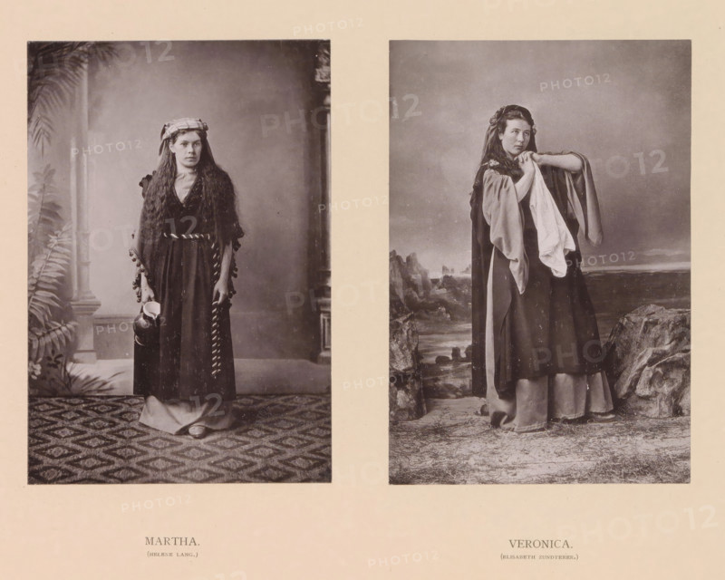 Martha, Veronica, page, photomechanical print, inscription: 'Gemeinde Oberammergau Passionsspiel 1890', photographer: Carl Stockmann, Oberammergau, cliché maker: anonymous, c. 1885 - in or before 1890, Bavaria, paper, collotype, photoprint, height 252 mm x width 335 mm, Prints opposite page 84., Person, Helene Lang, Elisabeth Zundterer, portrait of actor, actress, possible attributes: 'Sudarium' (veil with the image of Christ), the patroness of housewives, Martha of Bethany, possible attributes: aspergillum, broom, bunch of keys, dragon, ladle, Two vertical sepia photographs are mounted side by side on a pale background. The left photograph shows a woman standing indoors on a patterned rug with a leafy plant and column visible behind her; she wears a long dark dress with a textured shawl draped over her shoulders, a head covering, flat shoes, and holds a rounded jug near her side. The right photograph shows a woman standing outdoors on rocky ground with a painted coastal backdrop; she ...