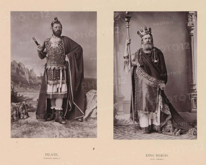 King Herod (Joh. Diemer), Pilate (Thomas Rendl.), page, photomechanical print, inscription: 'Gemeinde Oberammergau Passionsspiel 1890', photographer: Carl Stockmann, Oberammergau, cliché maker: anonymous, c. 1885 - in or before 1890, Bavaria, paper, collotype, photoprint, height 252 mm x width 335 mm, Prints opposite page 76., Christ before Pontius Pilate (Matthew 27:11-26, Mark 15:2-15, Luke 23:2-7, 23:13-25, John 18:28 - 19:16), Herod (not in biblical context), Two black and white portrait photographs placed side by side on a pale background depict two men in elaborate historical costumes. On the left a bearded man stands in front of a painted landscape, wearing ornate armor with decorative patterns, a short decorated skirt over tunic, a long cloak draped over one shoulder, and boots with fur trim; he holds a cylindrical object in one hand and has a small decorative headpiece. On the right a bearded man stands indoors beside a decorative column, wearing a richly patterned robe with f...