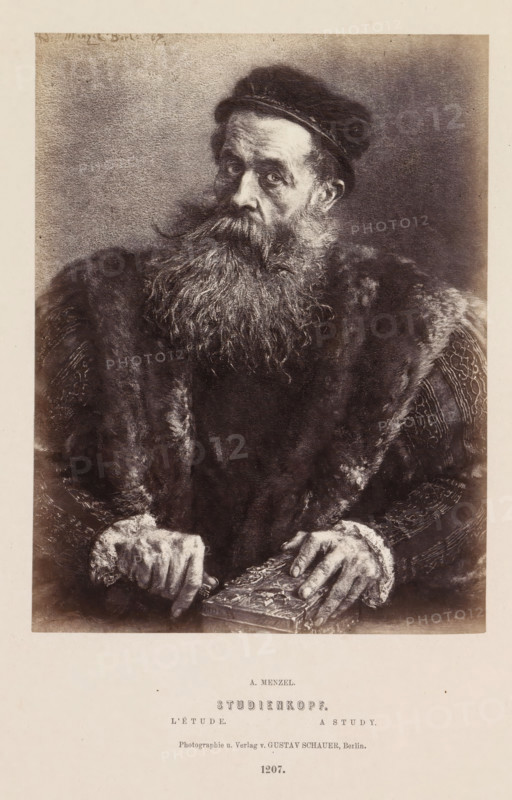Studienkopf, Photographic reproduction of a portrait of an unknown man with a beard by Adolf Menzel, photograph, reproduction, page, number: '1207.', photographer: Gustav Schauer, Berlin, after painting by Adolph Menzel, c. 1858 - in or before 1868, paper, albumen print, albumendruk, height 173 mm x width 131 mm, adult man, beard, A monochrome portrait of an older man shown from the waist up wearing a dark fur-lined cloak and a cap, his long, full beard and mustache flowing over his chest, his eyes looking slightly to the side, his hands resting on an ornately decorated book, with textured fabric visible on his sleeves and a plain background surrounding him.