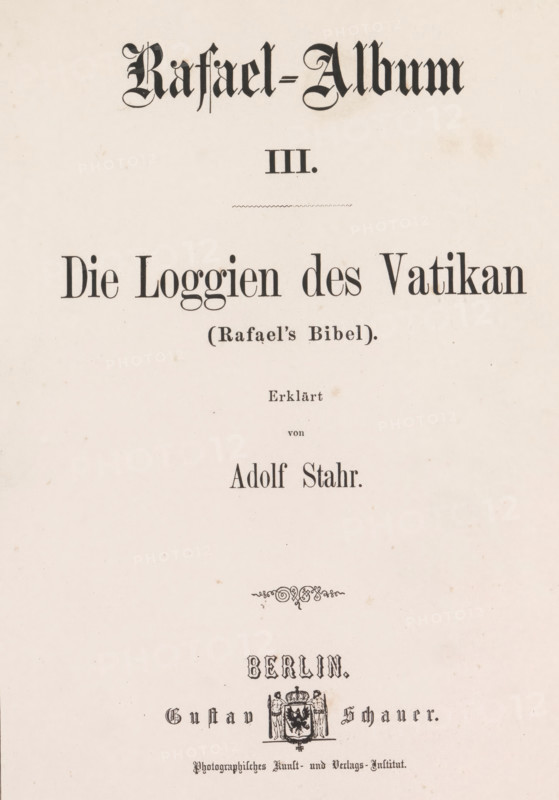 Rafael-Album III, book, writer (clerical worker): Adolf Stahr, printer (person): G. Bernstein, Berlin, publisher: Gustav Schauer, 1861, writer (clerical worker), printer (person), textile materials, pasteboard, paper, linen (material), albumen print, height 331 mm x width 260 mm x thickness 25 mm, The image shows a cream-colored page with ornate black printed headings and decorative elements; a large stylized title in a gothic typeface is at the top, followed below by a smaller centered line of text and a thin decorative rule, then a large serif heading across the width of the page with a parenthetical phrase beneath it; further down are several centered lines of serif text in varying sizes, a small ornamental flourish, and near the lower portion a decorative emblem featuring a shield flanked by figures and topped with a crown, all printed in black on the pale background.