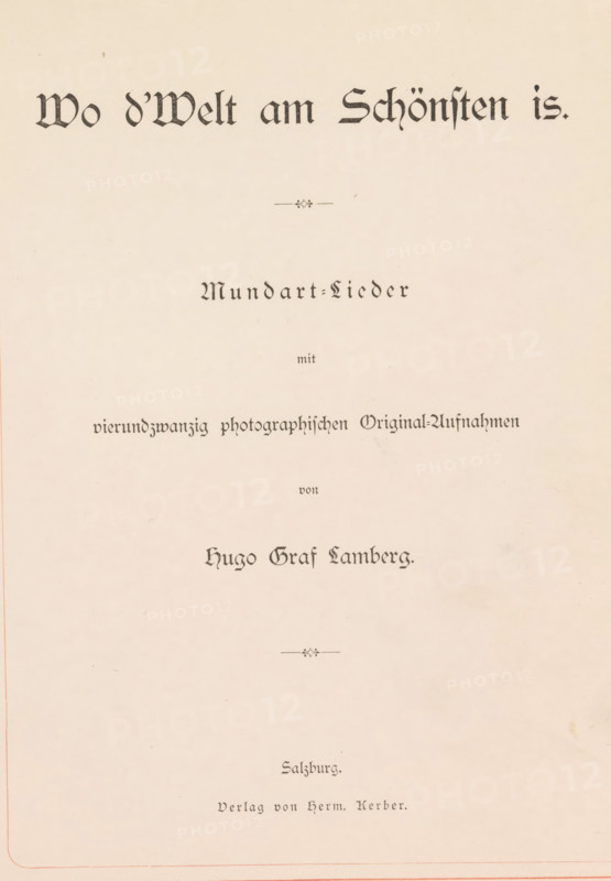 Wo d'Welt am Schönsten is, book, writer (clerical worker): Hugo Rainer Graf von Lamberg, publisher: Hermann Kerber, Salzburg (city), 1882, Hugo Rainer Graf von Lamberg, Hermann Kerber, writer (clerical worker), publisher, textile materials, pasteboard, paper, linen (material), printing, albumen print, color on cut, height 270 mm x width 205 mm x thickness 31 mm, A pale cream page with ornate blackletter headings and decorative flourishes, centered lines of stylized dark text in various sizes and weights spaced down the page, small ornamental divider motifs, and subtle age spots and faint smudges on the paper.