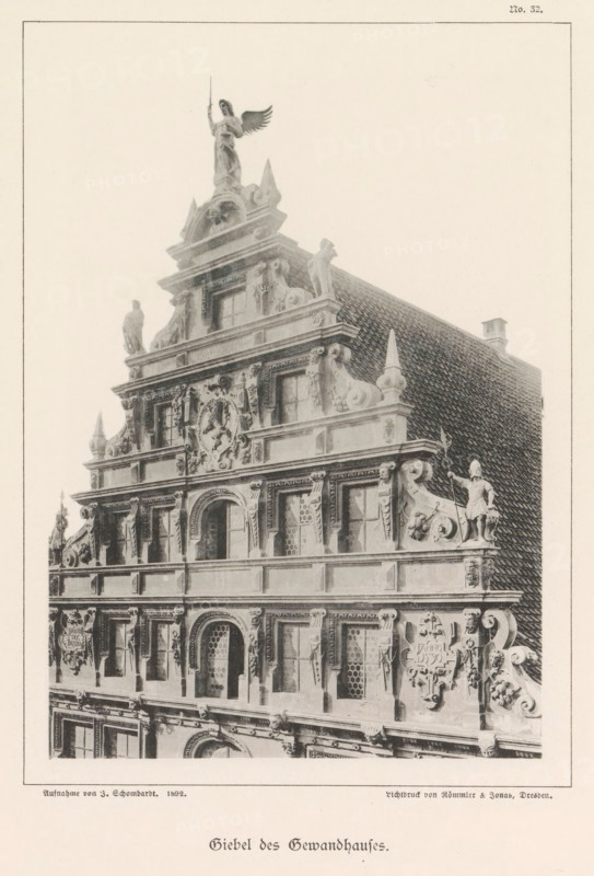 Giebel des Gewandhaus, Part of the facade of the Gewandhaus in Braunschweig, Braunschweig's Baudenkmäler, page, photomechanical print, number: 'No. 32.', photographer: J. Schombardt, Braunschweig, cliché maker: Römmler & Jonas, Dresden, publisher: Benno und Wilhelm Danert Goeritz, 1892, J. Schombardt, Römmler & Jonas, Benno und Wilhelm Danert Goeritz, photographer, cliché maker, publisher, Lower Saxony, Saxony, paper, collotype, photoprint, height 163 mm x width 113 mm, facade (of house or building), guildhall, Gewandhaus, The image shows the ornate facade and steep tiled roof of a historic building, featuring multiple tiers of sculptural architectural details including statues, carved reliefs, decorative scrolls, and framed windows with patterned panes; a winged figure stands atop the highest pediment holding a vertical staff, while other human figures and ornamental motifs occupy ledges and corners along the stepped gable, and the surface displays textured roof tiles and varied stone...