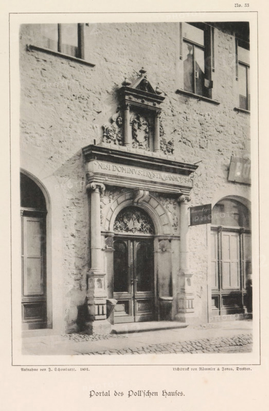 Entrance portal of a building in Braunschweig, Portal des Poll'schen Hauses, Braunschweig's Baudenkmäler, page, photomechanical print, number: 'No. 33.', photographer: J. Schombardt, Braunschweig, cliché maker: Römmler & Jonas, Dresden, publisher: Benno und Wilhelm Danert Goeritz, 1892, Lower Saxony, Saxony, paper, collotype, photoprint, height 161 mm x width 111 mm, facade (of house or building), gate, entrance, A grayscale photograph of a stone building facade showing an ornate arched doorway with carved columns and decorative relief above the lintel, flanked by smooth cylindrical pillars with molded bases and capitals; the double doors beneath the arch have carved panels and a patterned transom with ornamental tracery; the surrounding wall is textured stone with several rectangular windows at higher levels and recessed doorways at street level; a small rectangular hanging sign is mounted near one pillar; the ground in front of the entrance is uneven cobblestone.