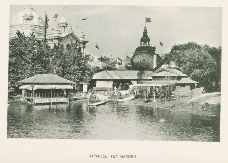 Japanese Tea garden, View of the Japanese tea garden at the World's Columbian Exposition in Chicago in 1893, page, photomechanical print, number: 'Plate 49', photographer: Charles Dudley Arnold, Chicago, photographer: HD Higinbotham, cliché maker: anonymous, 1893, Charles Dudley Arnold, HD Higinbotham, photographer, cliché maker, North America, Illinois, paper, collotype, light printing, height 120 mm x width 190 mm, tea garden, garden restaurant, world fair, world exhibition, World's Columbian Exposition, A riverside scene showing a covered pavilion on stilts projecting over the water with striped awnings, a dock extending from the shore, a cluster of wooden buildings with sloped roofs behind a small landscaped area, trees and shrubs surrounding the structures, a stone lantern and a small bridge-like walkway near the water, ornate domed and towered buildings visible above the trees in the background with flags flying from several points, and the water in the foreground reflecting the ...