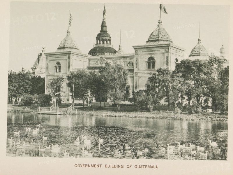 Government Building of Guatemala at the World's Columbian Exposition in Chicago in 1893, page, photomechanical print, number: 'Plate 78', photographer: Charles Dudley Arnold, Chicago, photographer: HD Higinbotham, cliché maker: anonymous, 1893, Charles Dudley Arnold, HD Higinbotham, photographer, cliché maker, North America, Illinois, paper, collotype, photoprint, height 133 mm x width 190 mm, world fair, world exhibition, World's Columbian Exposition, A large ornate building with multiple domed towers and arched windows sits behind a row of trees along a waterfront, with a central taller domed pavilion and flagpoles atop some towers, decorative architectural details on the façades, a small dock with steps leading to the water, and numerous waterfowl swimming on the reflective surface in the foreground.