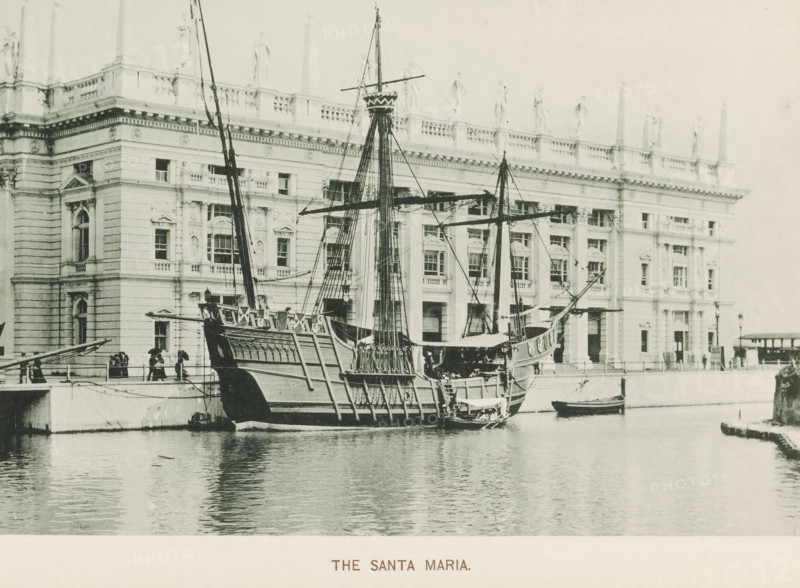 The Santa Maria, Replica of the Santa Maria, a sailing ship of Christopher Columbus, at the World's Columbian Exposition in Chicago in 1893, page, photomechanical print, number: 'Plate 85', photographer: Charles Dudley Arnold, Chicago, photographer: HD Higinbotham, cliché maker: anonymous, 1893, Charles Dudley Arnold, HD Higinbotham, photographer, cliché maker, North America, Illinois, paper, collotype, photoprint, height 133 mm x width 190 mm, ships (in general), world fair, world exhibition, World's Columbian Exposition, A large wooden sailing ship with tall masts and rigging is moored at a quay in front of an ornate multi-story stone building. The ship shows detailed carved railings and a raised stern, with ropes and spars extending upward and outward. The building behind has rows of windows, decorative columns, cornices, and statues along its roofline. People stand on the quay near the ship, some under umbrellas, and a small rowboat is alongside the larger vessel on the water, whic...