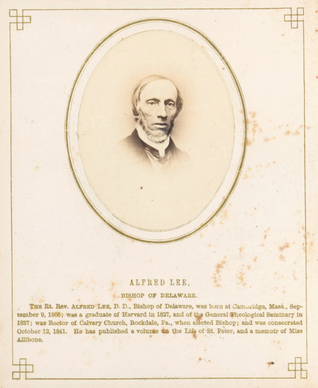 Portrait of Alfred Lee, photograph, page, inscription: 'Alfred Lee, Bishop of Delaware, ', photographer: J. Gurney & Son, in or after 1861-10-16 - in or before 1861-10-20, Jeremiah Gurney & Son, paper, albumen print, albumendruk, height 70 mm x width 53 mm, Person, Alfred Lee, historical persons, An aged, sepia-toned portrait of a man with a narrow face, receding hairline, and sideburns set inside an oval frame centered on a pale rectangular page with decorative corner motifs, a thin double-lined border around the oval, and scattered brownish foxing stains across the page.
