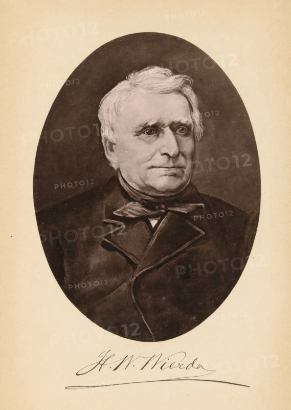 Portrait of HW Wierda, HW Wierda, page, photomechanical print, cliché maker: Friedrich Julius Klinkhardt (possibly), Leipzig, c. 1883 - in or before 1887, photographer, printer (person), Saxony, paper, collotype, photogravure, height 151 mm x width 111 mm, Print opposite title page, behind semi-transparent cover., Person, historical persons, An oval portrait of an older man with light hair combed to the side, visible from the chest up, set against a dark background and surrounded by a lighter rectangular mat; he wears a dark coat with wide lapels and a bow at the collar, and his expression is neutral with eyes looking slightly to one side.