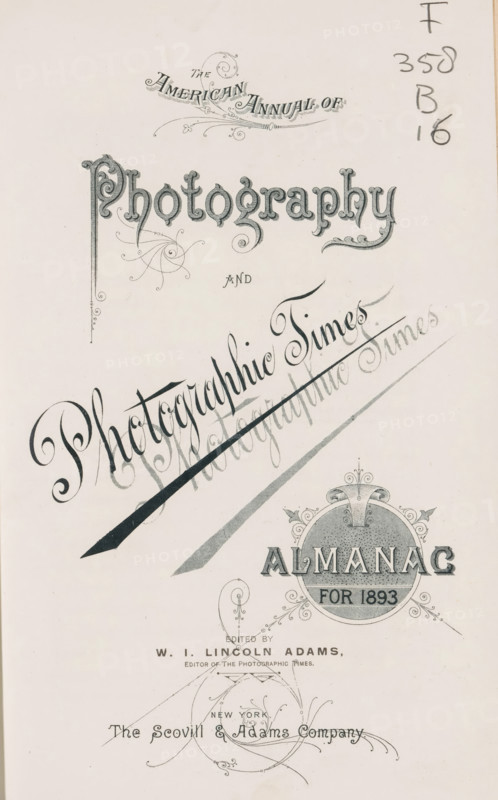 The American annual of photography and photographic times almanac for, book, annotation: '95580, 300, -, ... cataloge photographicus', date: 'May 1998', editor (person who revises): Washington Irving Lincoln Adams, publisher: Scovill and Adams, New York (city), 1887 - 1907, editor (person who revises), North America, textile materials, paper, linen (material), transparent paper, printing, daylight gelatin silver print, autotype, collotype, height 249 mm x width 153 mm x thickness 39 mm, A cream-colored page with ornate dark gray ornamental lettering and decorative flourishes arranged in a vertical layout, featuring a large stylized title in an elaborate serif script near the top, swirling calligraphic embellishments and a diagonal decorative ribbon crossing the center, a circular ornate emblem with a textured interior and ornamental scrollwork near the lower right, delicate filigree elements and flourishes scattered across the page, and a small column of handwritten numerals and marks ...