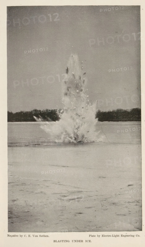 Timer with a falling ball to measure shutter speed, page, photomechanical print, c. 1888 - in or before 1893, paper, autotype, height 114 mm x width 53 mm, statistic diagram, graph, pictorial chart, A vertical black-and-white photograph showing a frozen flat surface with a high, dramatic vertical spray of water and ice fragments erupting from a central point, surrounded by scattered flying shards and a misty plume, a distant dark treeline visible along the horizon behind the explosion, and a large expanse of smooth ice in the foreground.