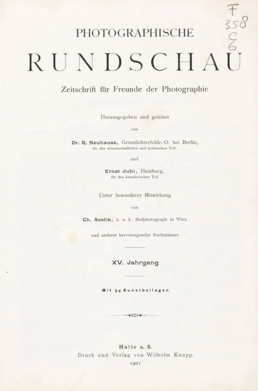 Photographische Rundschau : Zeitschrift für Freunde der Photographie, magazine, annotation: 'Emil .ux, 1901', editor (person who revises): Richard Neuhauss, editor (person who revises): Ernst Juhl, printer (person): Wilhelm Knapp, Halle an der Saale, 1901, editor (person who revises), printer (person), Saxony-Anhalt, textile materials, pasteboard, biological material, paper, linen (material), leather, printing, autotype, photoaquatint, cut marble, stone marbled paper, height 275 mm x width 208 mm x thickness 35 mm, A vertically oriented aged paper page with dark printed lines and headings arranged down the center, featuring large bold serif characters near the top, smaller serif lines below, several horizontal separators, a small decorative flourish near the lower middle, and light brown spotting and foxing marks scattered across the surface, with a pencil notation along the right upper edge.