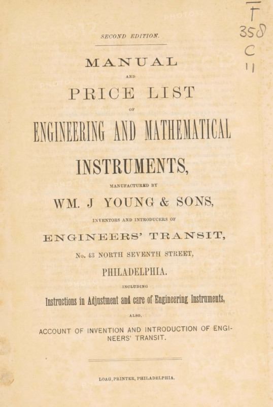 Interior of a room with mathematical instruments, Rear portion graduating room of Wm. J. Young & Sons, photograph, page, Philadelphia, c. 1870 - in or before 1875, photographer, North America, paper, albumen print, height 124 mm x width 206 mm, Photo opposite title page., calculating-instruments, A vertically oriented aged paper page with printed lines of large serif text arranged in centered lines from top to bottom, featuring a faded beige background and darker printed ink that appears worn in places, slight brown spotting and discoloration around the edges, and a vertical handwritten marking in dark ink near the upper right margin.