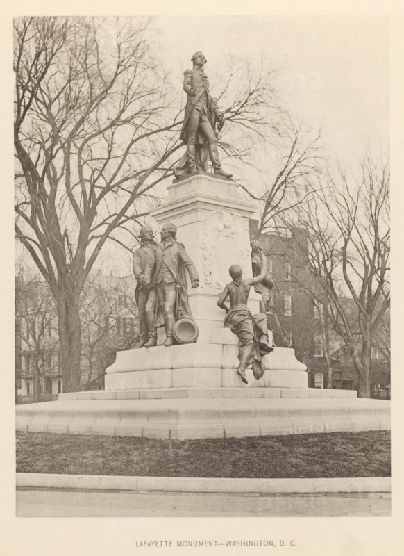 View of a statue by Gilbert du Motier de La Fayette in Washington DC, Lafayette Monument - Washington, DC, page, photomechanical print, Washington DC, c. 1891 - in or before 1893, North America, District of Columbia, paper, collotype, photoprint, height 193 mm x width 145 mm, Person, Gilbert du Motier (marquis de La Fayette), monument, statue, A stone monument with multiple bronze statues sits on a raised square pedestal in a park setting, with bare trees and a few buildings visible behind it; a central standing figure in a military coat is positioned atop the pedestal looking outward, while below on one side two uniformed male figures stand close together near a large drum and on another side a draped female figure reaches upward toward another reclining or seated figure partially obscured by the pedestal; the scene is rendered in a monochrome photographic tone and framed by leafless tree branches against a pale sky.