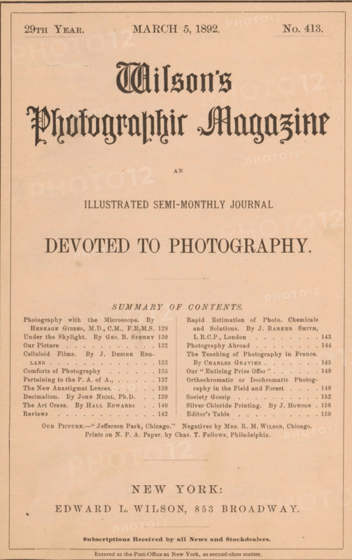 Wilson's photographic magazine, magazine, publisher: Edward Livingston Wilson, New York (city), 1892-03-05, Edward Livingston Wilson, publisher, North America, paper, printing, autotype, wood engraving, albumen print, height 255 mm x width 177 mm x thickness 4 mm, The image shows the front page of an old magazine printed on beige paper with a narrow dark border, featuring a large ornate blackletter title near the top and several lines of smaller type arranged in centered and column formats below, including a bold headline in larger serif type across the middle, a block of summary text in two narrow columns, and a smaller centered line of text near the bottom above a larger centered place-name line and a final line of small print at the very bottom; there are faint age spots and slight creases visible on the paper.