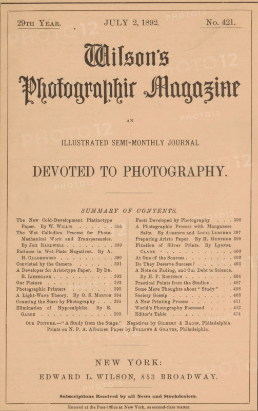 Wilson's photographic magazine, magazine, publisher: Edward Livingston Wilson, New York (city), 1892-07-02, Edward Livingston Wilson, publisher, North America, paper, printing, wood engraving, autotype, albumen print, height 256 mm x width 176 mm x thickness 4 mm, The image shows a vintage magazine cover printed on tan paper with a thin rectangular border and ornate black typography; large stylized decorative lettering dominates the upper portion, with smaller serif headings and columns of dense printed lists below; a horizontal rule separates sections, and a centered line of bold capital text appears midway; the lower portion features additional centered text and a larger serif name near the bottom; the overall layout is symmetrical with narrow margins and an aged paper texture.