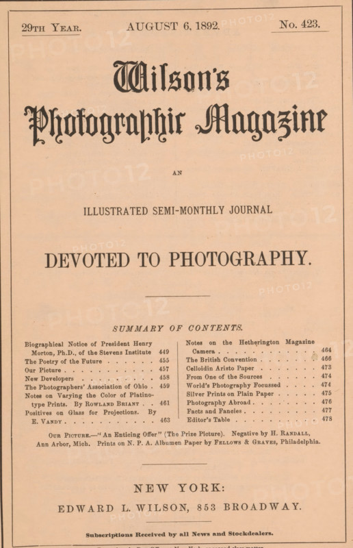 Wilson's photographic magazine, magazine, publisher: Edward Livingston Wilson, New York (city), 1892-08-06, Edward Livingston Wilson, publisher, North America, paper, printing, wood engraving, autotype, albumen print, height 258 mm x width 175 mm x thickness 4 mm, A full-page vintage magazine cover with a pale salmon background and a thin dark border, featuring ornate blackletter title lettering near the top, several lines of centered, bold serif headings in different sizes across the page, a horizontal rule separating sections, and two narrow columns of smaller printed entries toward the lower third. The page shows aged paper texture with slight discoloration and a few small spots, even margins, and a larger block of centered text and typographic elements near the bottom.