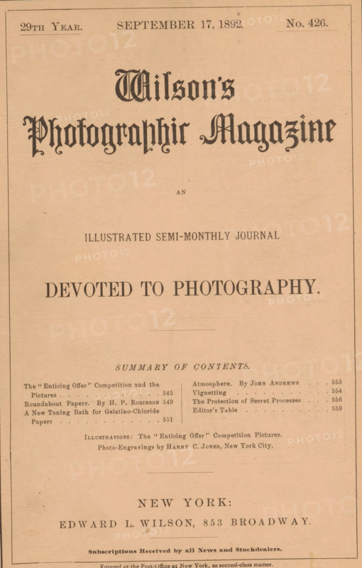 Wilson's photographic magazine, magazine, publisher: Edward Livingston Wilson, New York (city), 1892-09-17, Edward Livingston Wilson, publisher, North America, paper, printing, wood engraving, autotype, height 256 mm x width 175 mm x thickness 4 mm, A faded sepia-toned printed page with a decorative large title near the top in ornate blackletter-style lettering, centered on the page, followed by smaller lines of printed headings and a prominent bold centered slogan in uppercase serif type. There are thin rectangular border lines near the page edges and a series of narrow horizontal rules separating sections. Below the main area is a multi-column list of brief printed lines and dots aligned in columns with small gaps between columns, and lower on the page are centered lines of larger serif text separated by subtle rules, all on aged paper with light speckles and creases.