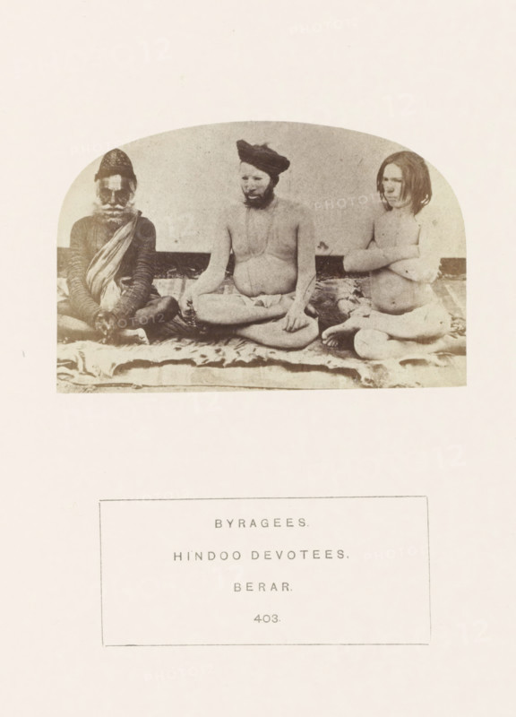 Portrait of three unknown men from the Bairagi community of the former Berar in central India, photograph, page, number: '403.', inscription: 'BYRAGEES., HINDOO DEVOTEES., BERAR.', photographer: James Mulheran (possibly), Berar, 1862, paper, albumen print, height 64 mm x width 95 mm, human races, peoples, nationalities, asceticism, Hinduism, Buddhism, Jainism, A sepia-toned photograph shows three seated people on a patterned cloth against a plain backdrop, each occupying a distinct position across the frame; the left person wears a patterned cap and layered garments with a draped cloth across the chest and has a beard and mustache, the central person is bare-chested with a turban and a beard, sitting cross-legged with hands resting in the lap while holding a string of beads, and the right person is bare-chested with shoulder-length hair, arms crossed over the chest, seated with legs folded.