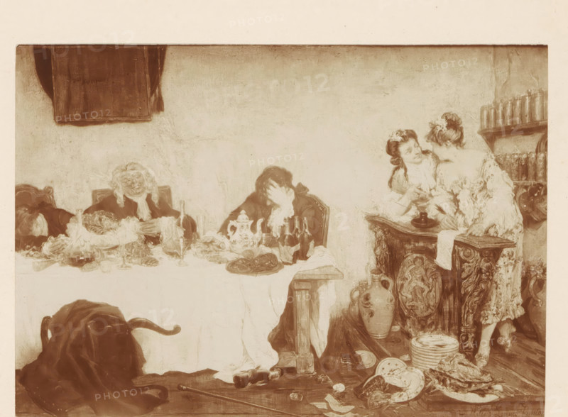 Photo reproduction of a painting of Rabelais's quarters by Willem Linnig (II), photograph, reproduction, page, photographer: Alexandre van Antro, after painting by Willem Linnig (II), c. 1891 - in or before 1896, Alexandre van Antro, Willem Linnig (II), photographer, after painting by, paper, daylight collodion silver print, height 113 mm x width 161 mm, adult woman, adult man, banquet of elegant company, A sepia-toned scene of a banquet with a long table covered by a cloth and scattered dishes, glassware, and serving pieces, with three seated figures wearing old-fashioned clothing and wigs, two of whom have their heads bowed on the table and one with a hand over the face. To the right, two standing women in ornate dresses lean toward each other near an intricately carved wooden sideboard topped with plates and a large pitcher, and shelves holding bottles rise behind them. The foreground shows overturned chairs, a draped cloak, broken plates, stacked dishes, scattered food, a cane, and...