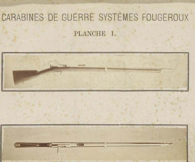 Rifle, photograph, page, Above a side view, below a top view., name: 'Ed. Magis photographe Liège.', inscription: 'Carabines de guerres systèmes Fougeroux', number: 'Planche 1.', photographer: Edouard Magis, Liège, c. 1857 - in or before 1867, paper, albumen print, height 253 mm x width 178 mm, Images in section at the back., A faded, aged page with two horizontal framed photographs of long rifles; the upper photograph shows a wooden-stocked rifle with a curved butt, a slender barrel, a trigger and simple sighting hardware, all set against a light, mottled background, and the lower photograph shows another long firearm with a straight stock, metal fittings along the barrel, and a bayonet lug, also set within a rectangular border on the same spotted paper.