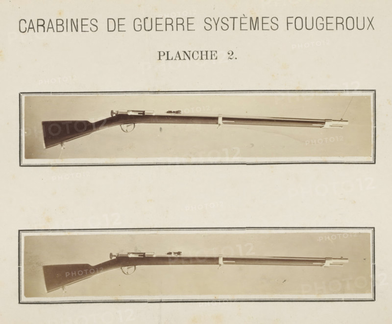 Two images of a rifle, photograph, page, number: 'Planche 2.', inscription: 'Carabines de guerres systèmes Fougeroux', photographer: Edouard Magis, Liège, c. 1857 - in or before 1867, paper, albumen print, height 253 mm x width 178 mm, Images in section at the back., firearms: rifle, A vertically oriented rectangular page shows two horizontal sepia-toned photographic panels each bordered by a double-lined frame, each panel containing a side view of a long wooden rifle with a dark stock, a metal barrel, and visible trigger and bolt components, the upper panel rifle positioned near the top third of the page and the lower panel rifle positioned nearer the middle, both set against a light neutral background with small blemishes and age spots on the page.