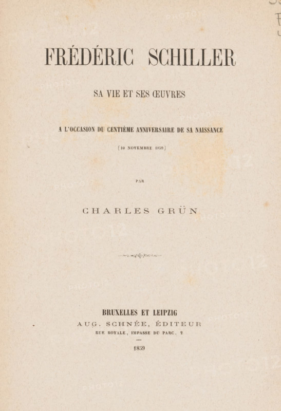 Frédéric Schiller, his life and his oeuvres : a centième anniversary of the naissance (November 10, 1859), by Charles Grün, book, annotation: 'Photo mis de Radaux', writer (clerical worker): Charles Grün, publisher: Auguste Schnée, Brussels, Leipzig, 1859, writer (clerical worker), Saxony, textile materials, pasteboard, paper, linen (material), printing, albumen print, snail marbled paper, stone marbled paper, height 217 mm x width 148 mm x thickness 11 mm, A rectangular page with aged, off-white paper showing slight foxing and faint stains, centered layout with bands of darker print impression near the top and middle, a small decorative flourish near the center, and a clear area of lighter paper toward the bottom, all set within a margin of blank space.