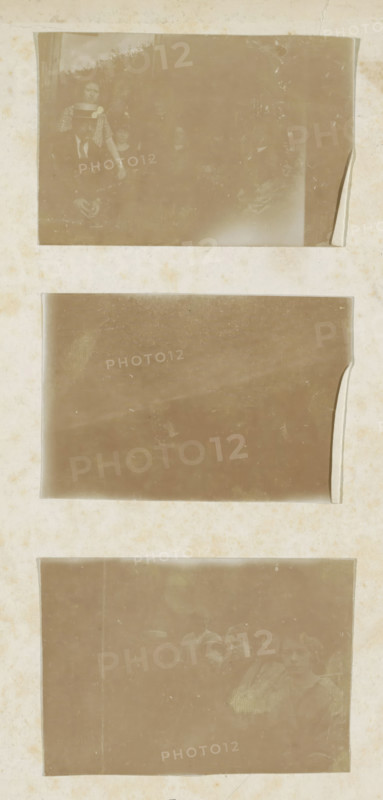 Revue spirite, book, printer (person): Rouge, Dunon et Fresné, Paris, compiler (person in literature): Pierre-Gattan Leymarie, 1874, printer (person), compiler (person in literature), textile materials, pasteboard, paper, linen (material), printing, albumen print, agate marbled paper, height 241 mm x width 160 mm x thickness 25 mm, A vertical sheet with three rectangular sepia-toned photographic slots arranged top to bottom, each slot showing faded, scratched surfaces and slightly curled edges; the top slot contains a faint group portrait with a person wearing a hat and others partially visible behind, the middle slot is largely blank with smudges and worn corners, and the bottom slot shows a faint scene of several people with indistinct faces and clothing; the surrounding sheet has an aged, spotted texture with discoloration and subtle stains.