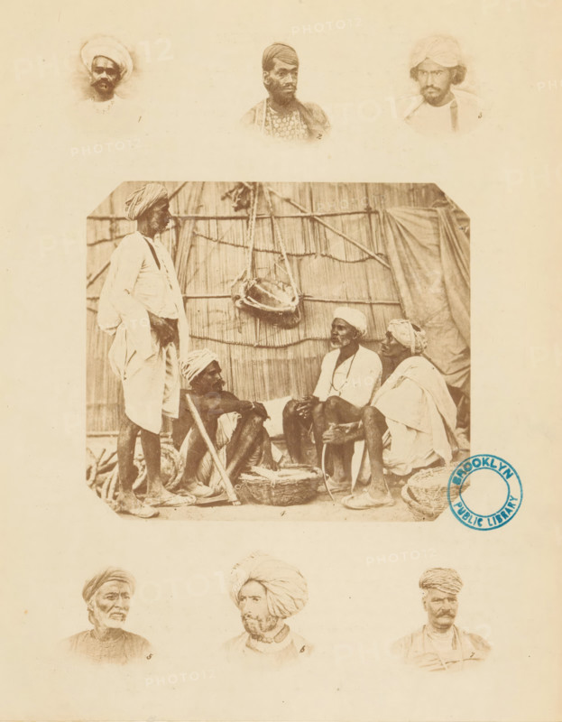 Collection of portraits and a company of Indian men illustrating various types of turbans. Plain and colored, photograph, page, inscription: 'PL. I., Costume-Illustrations', collector's mark: 'Brooklyn Public Library', printer (person): William H. Griggs, c. 1861 - in or before 1866, William H. Griggs, photographer, printer (person), paper, albumen print, height 260 mm x width 207 mm, historical persons, head-gear: turban, A sepia-toned image sheet with faded portrait heads along the top and bottom edges and a larger central photograph showing a group of men seated and standing in front of a woven reed or thatch backdrop; in the central scene one man stands wearing a wrapped head covering and loose garments while three others sit on the ground in traditional wraps and turbans, one leaning on a stick and another holding a long curved pipe, with baskets and a hanging object visible against the backdrop; the sheet shows a circular stamp near the lower right of the central photograph.