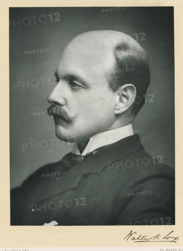 The right honorable Walter Hume Long, photograph, page, annotation, inscription: '55, Baker St, London, W.', photographer: Elliott & Fry, c. 1893 - c. 1903, paper, carbon print, height 227 mm x width 171 mm, Person, Walter Long, historical persons (portraits and scenes from the life) ((full) bust portrait), A black and white portrait of a man shown in profile facing left with a neatly groomed mustache and a smooth, receding hairline, wearing a high, stiff collar and a dark suit jacket with a visible bow tie and lapel, framed by a light border.