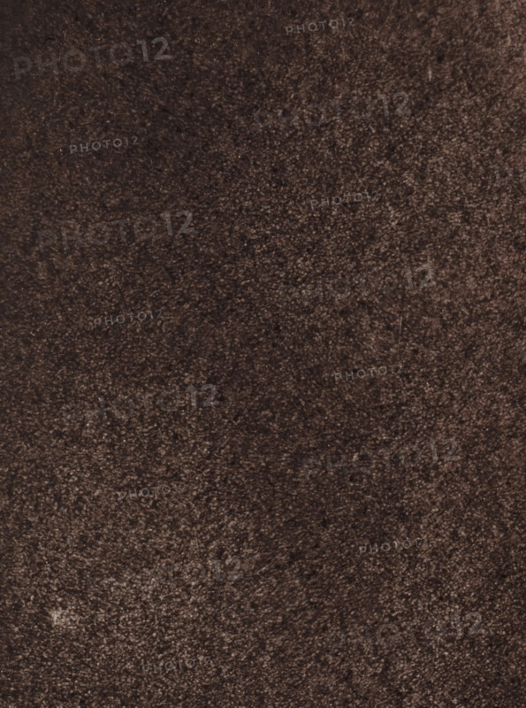 Observatoire de Meudon - études de la surface solaire (régioncentrale), Study of the solar surface, photograph, page, inscription: '9 Septembre 1883- 8h 50m 20 s, (Régioncentrale), Diamètre du discque: 0m894', inscription: 'Pl. I', 1883-09-09, photographer, paper, carbon print, height 230 mm x width 170 mm, physical aspects of the sun, Zon, A close-up view of a textured surface with a uniform rough pattern in dark brown and gray tones, showing small variations in shading and tiny irregular specks and fibers scattered across the area.
