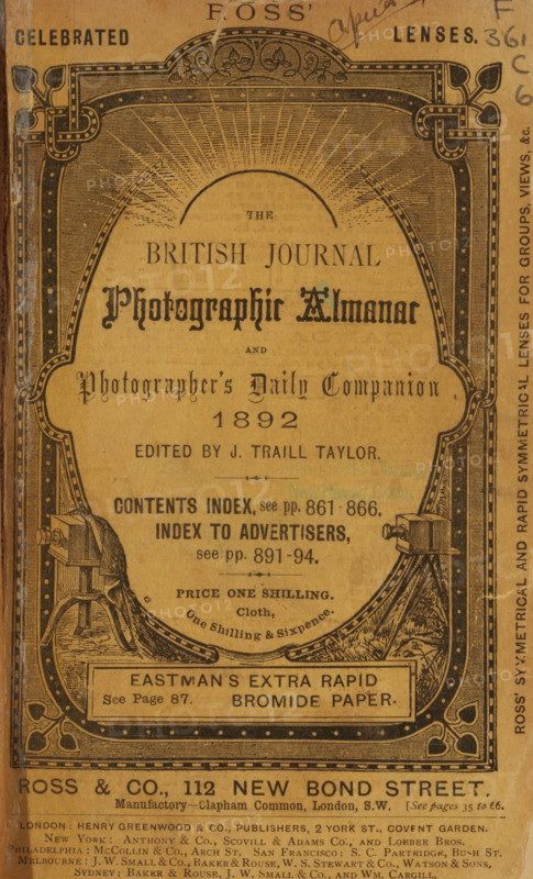 The British journal photographic almanac and photographer's daily companion, book, annotation: '95-', collector's mark: 'Free Pulic Library of New Haven', date: 'MAY 1994', editor (person who revises): James Traill Taylor, publisher: various manufacturers, 1859 - 1861, editor (person who revises), paper, printing, gelatin silver print, collotype, developing gelatin silver print, height 182 mm x width 133 mm x thickness 56 mm, A worn paper cover with ornate black printed borders and decorative corner designs surrounding central printed text; an arch-like patterned frame at the top contains radiating linework, ornamental flourishes, and two stylized vine motifs; the central area features a variety of typographic styles including a prominent ornate title in a dark ink, smaller serif and script text blocks, and a horizontal boxed label near the bottom; two illustrated tripod-mounted cameras or apparatus are positioned symmetrically at lower left and right within the frame; marginal handwri...