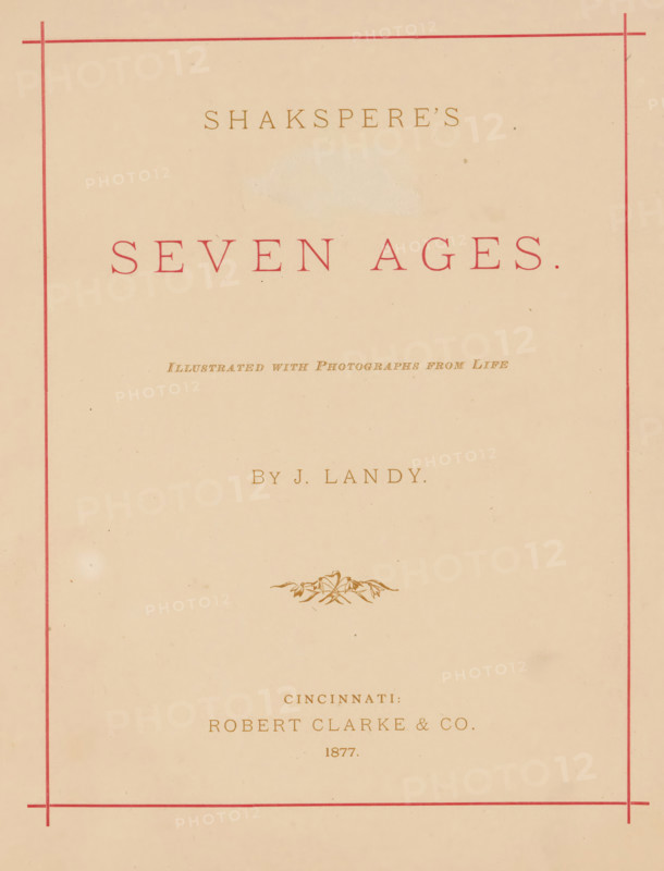 Shakespere's Seven ages, book, annotation: 'Mary Boswell, from, Lizzie C. White, Christmas1876', annotation: 'FEB.2003', photographer: James M. Landy, publisher: Robert Clarke & Co., Cincinnati, c. 1877, James M. Landy, Robert Clarke & Co., photographer, publisher, North America, pasteboard, paper, textile materials, printing, autotype, albumen print, height 254 mm x width 202 mm x thickness 14 mm, A faded cream-colored page framed by thin red borders with decorative corner ticks, featuring a large centered title in a muted red serif type, smaller lines of brownish-gold serif text above and below the title, a small ornate botanical flourish in brownish-gold near the middle, and light age spots and faint smudges scattered across the page.