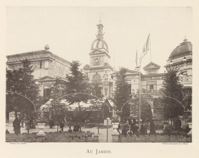 Au jardin, Garden on the grounds of the world exhibition in Antwerp, page, photomechanical print, photographer: Th. Lantin, Antwerp, printer (person): Joseph Maes, c. 1890 - in or before 1894, printer (person), paper, collotype, photoprint, height 159 mm x width 218 mm, garden, facade (of house or building), A wide sepia-toned street scene showing an ornate row of classical buildings with decorative facades, a central tower topped by a domed metal structure and a small lantern, flags on tall poles, and trees partially obscuring the lower parts of the buildings, with outdoor seating and people gathered in the foreground.