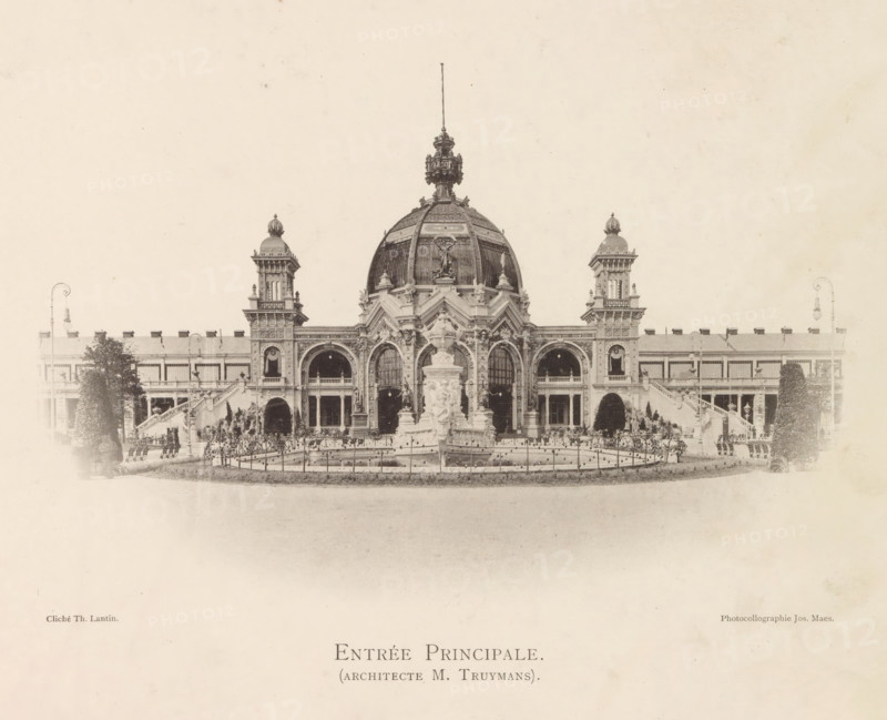 Exposition universelle d'Anvers, 1894, book, photographer: various manufacturers, cliché maker: Joseph Maes, various manufacturers, Joseph Maes, photographer, cliché maker, textile materials, pasteboard, paper, linen (material), printing, collotype, veined marbled paper, height 271 mm x width 375 mm x thickness 40 mm, A wide frontal view of a grand ornate building with a large central dome topped by a decorative finial and flanked by symmetrical towers, each with domed caps and sculptural details; the facade shows arched entrances, columns, balconies, and intricate carvings, with a prominent sculpted fountain and ornamental statues positioned in front of the central entrance and a low fenced pool surrounding it; landscaped elements including trimmed trees and bushes appear at the sides, and a pair of curved street lamps stand near the outer edges of the composition; the image has a faded, sepia-toned appearance.
